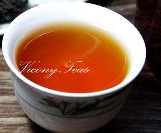 the tea infusion of keemun black peony tea flower